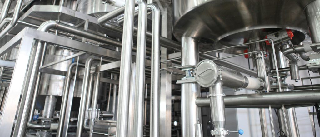 Stainless steel process tanks and sanitary piping in a production plant