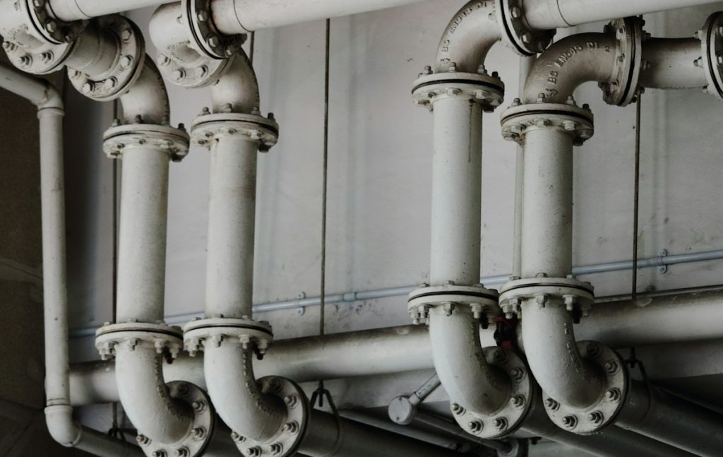 Flanged pipe bends in an industrial plant