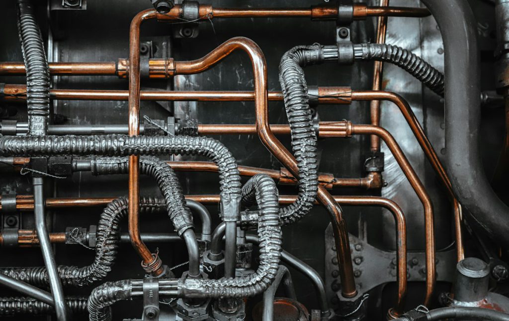 Copper and steel tubing routed across industrial equipment