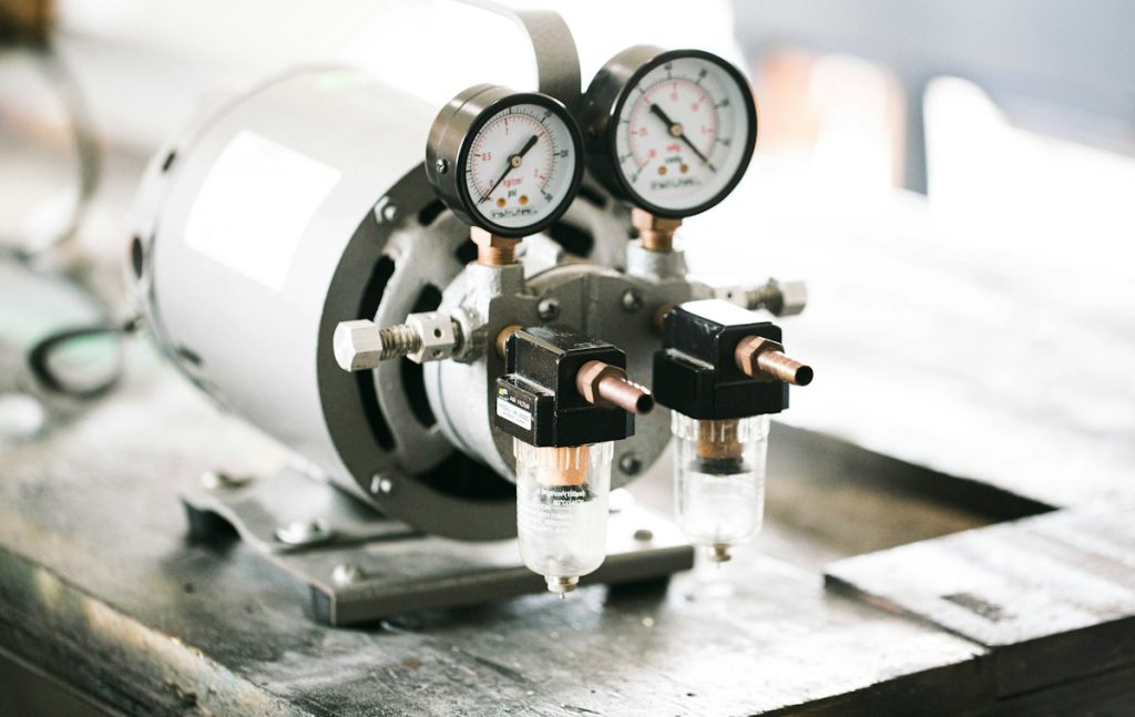 Pressure gauges and valves mounted on a motor-driven pump
